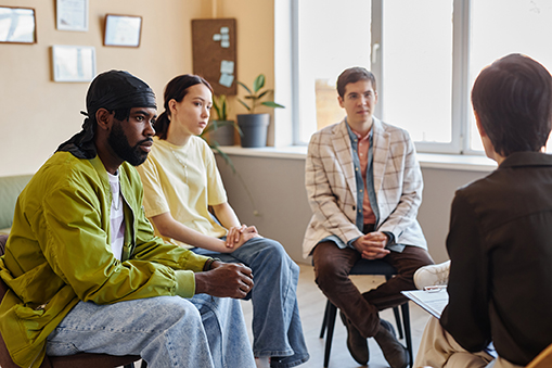 Young people listening to psychologist